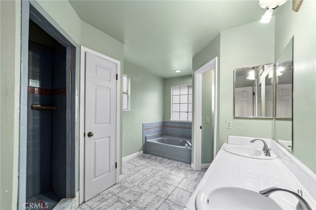 6770 Sandy Lane Riverside, CA 92505 - Photo 17 of 28 a bathroom with a sink and mirror