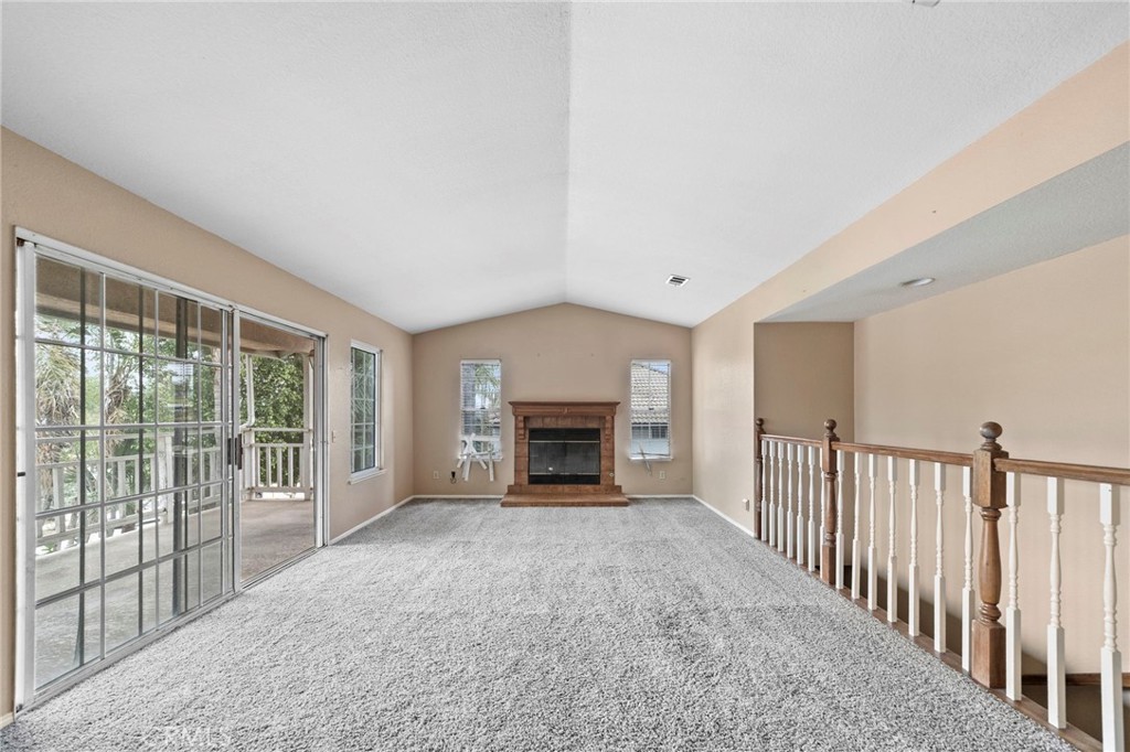 6770 Sandy Lane Riverside, CA 92505 - Photo 6 of 28 a view of a livingroom with an empty space and a fireplace