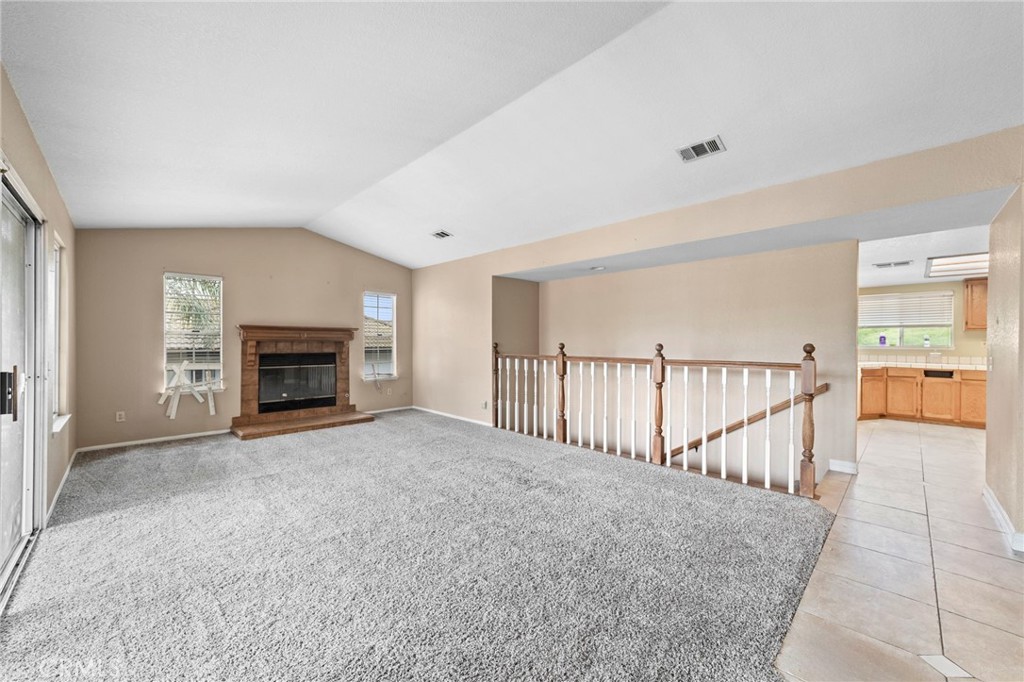 6770 Sandy Lane Riverside, CA 92505 - Photo 7 of 28 a view of empty room with fireplace and fan