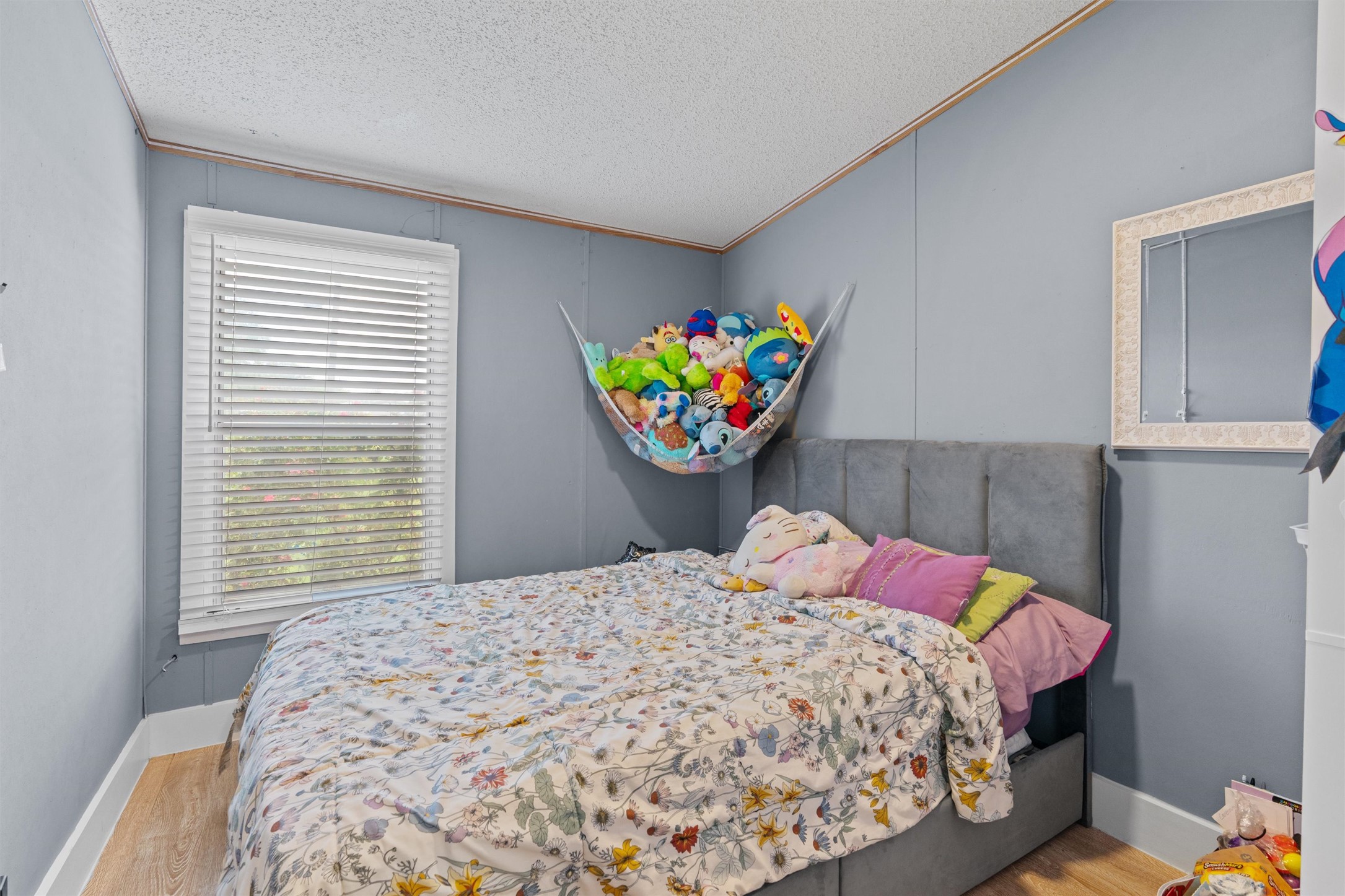218 Boxcar Path Kyle, TX 78640 - Photo 9 of 21 Restful bedroom retreat with bright window illumination and ample floor space for comfort.