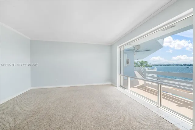 a view of an empty room and a window