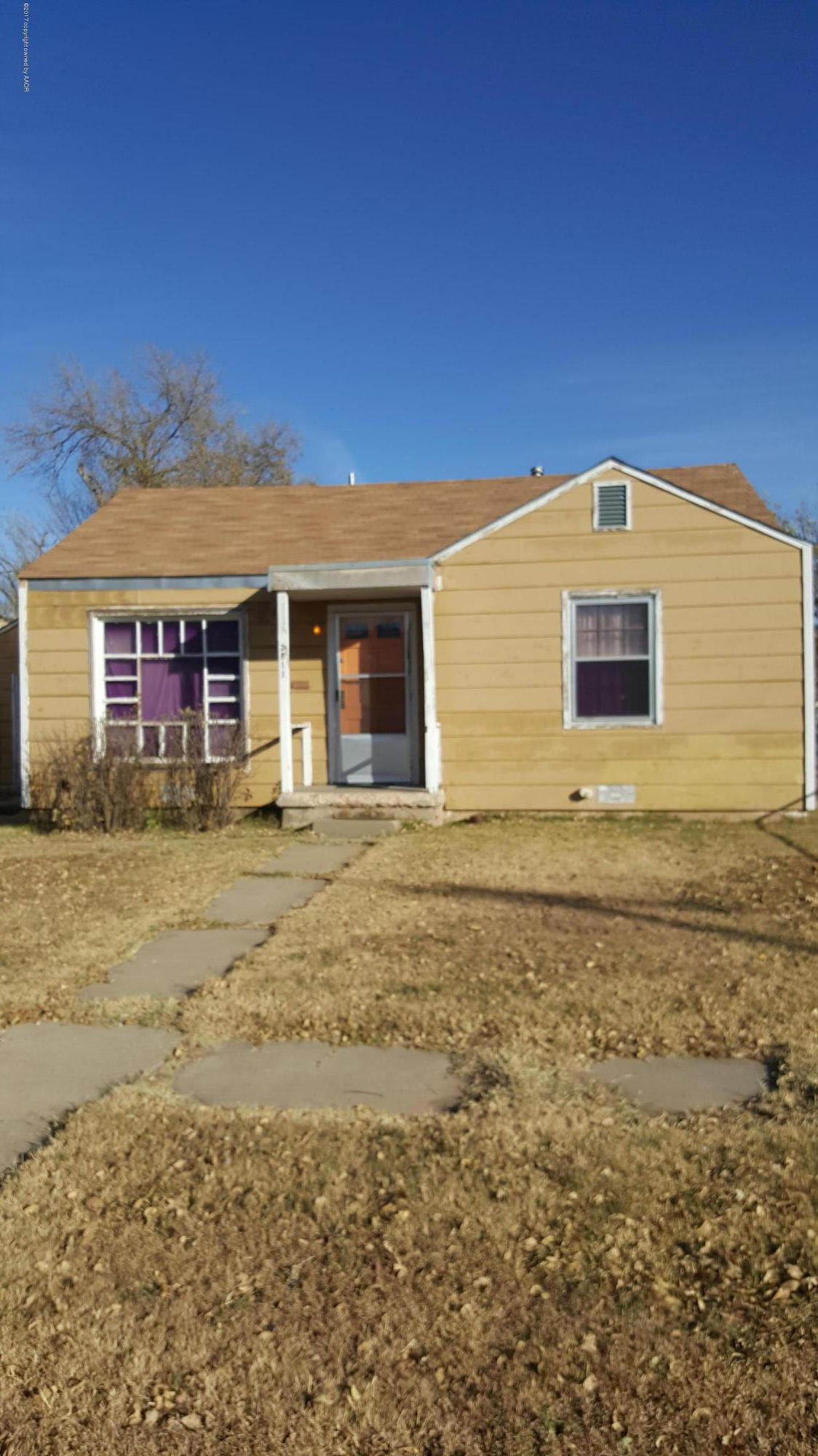 3811 South Tyler Street Amarillo, TX 79110 - Photo 1 of 10 a front view of a house with a yard