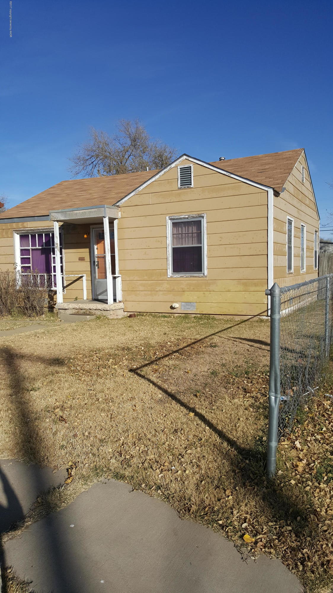 3811 South Tyler Street Amarillo, TX 79110 - Photo 3 of 10 a front view of a house with a yard