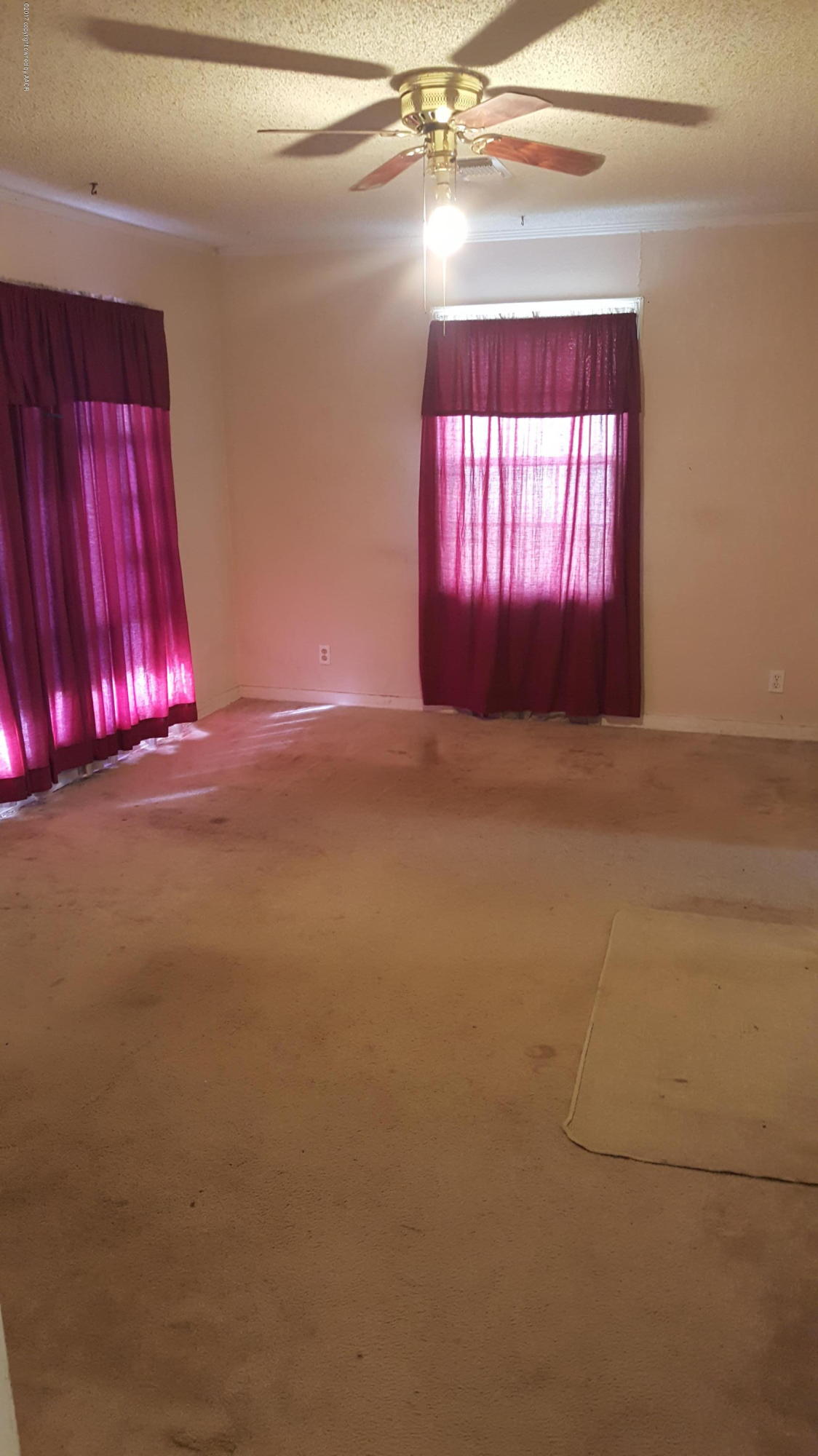 3811 South Tyler Street Amarillo, TX 79110 - Photo 4 of 10 a view of empty room with windows