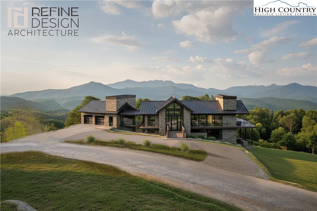 a view of a town with mountains & house