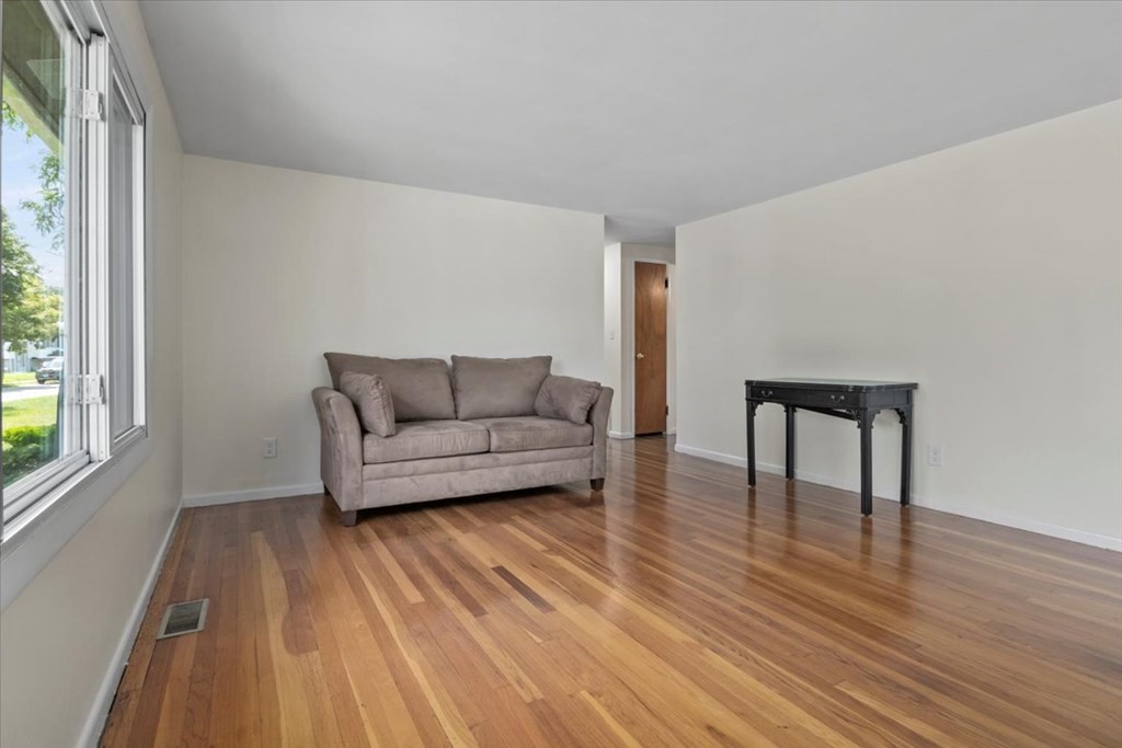 51 Joan Road Boston, MA 02136 - Photo 3 of 42 a living room with furniture and a wooden floor
