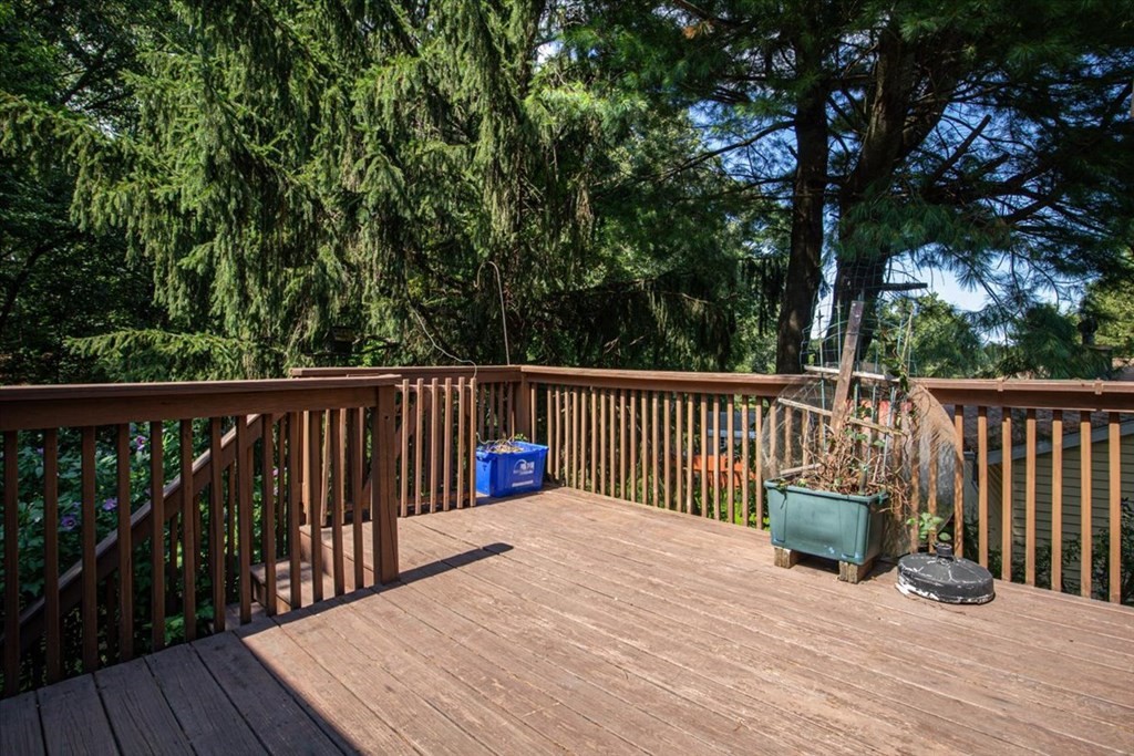 51 Joan Road Boston, MA 02136 - Photo 36 of 42 a balcony with wooden floor and fence