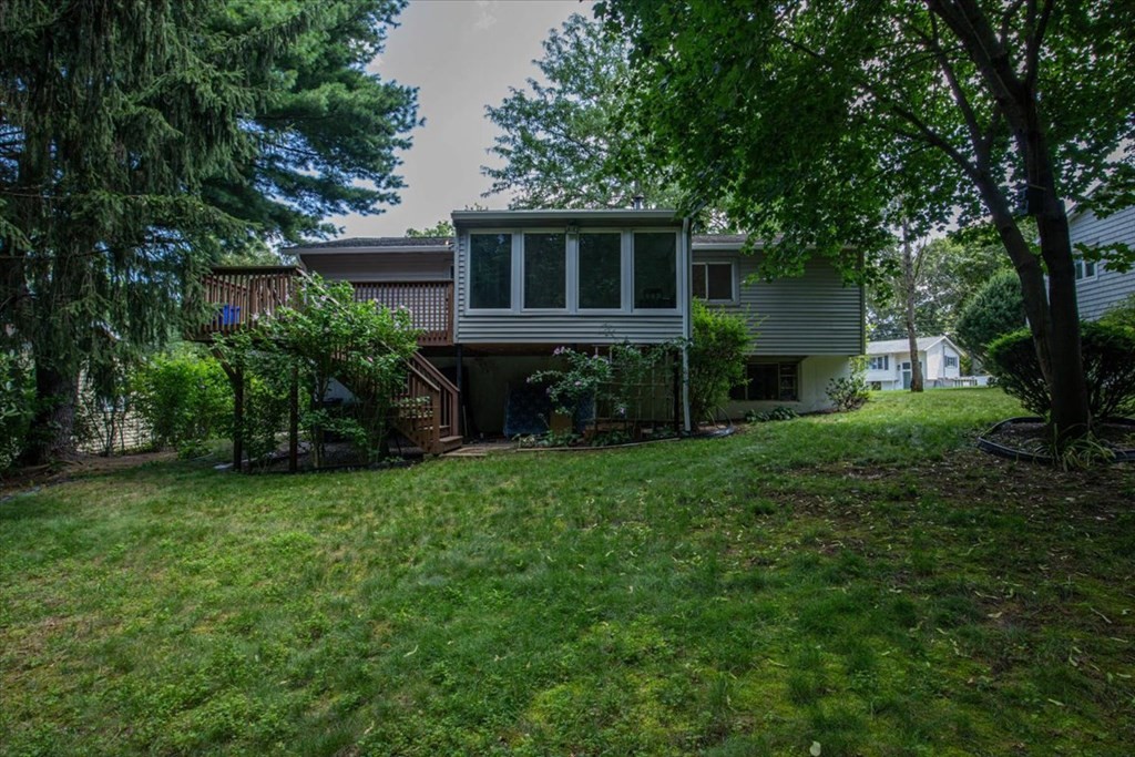 51 Joan Road Boston, MA 02136 - Photo 38 of 42 a view of a house with a yard and a garden
