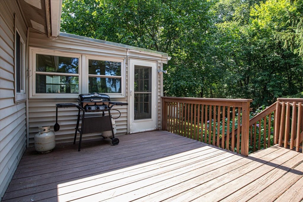 51 Joan Road Boston, MA 02136 - Photo 41 of 42 a view of a deck with table and chairs with wooden floor and fence