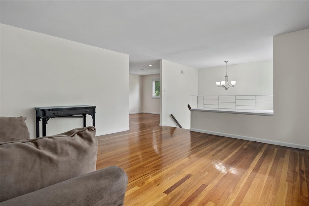 51 Joan Road Boston, MA 02136 - Photo 5 of 42 a living room with furniture and a wooden floor
