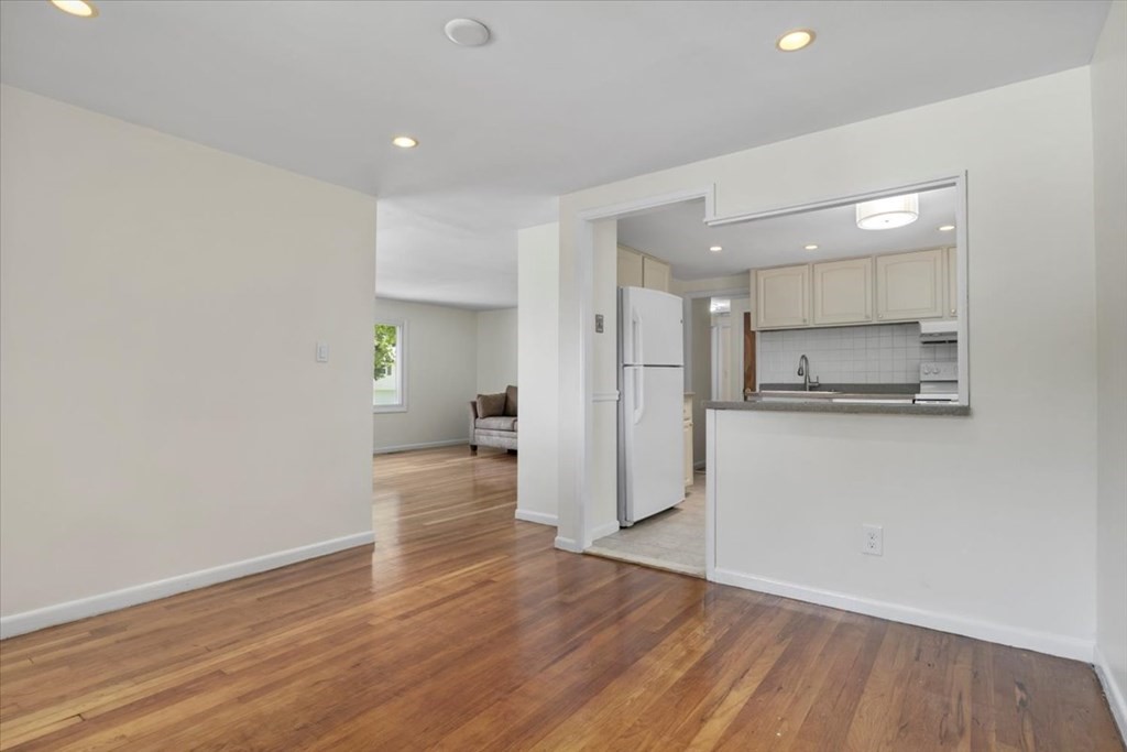 51 Joan Road Boston, MA 02136 - Photo 9 of 42 a view of kitchen with refrigerator and wooden floor