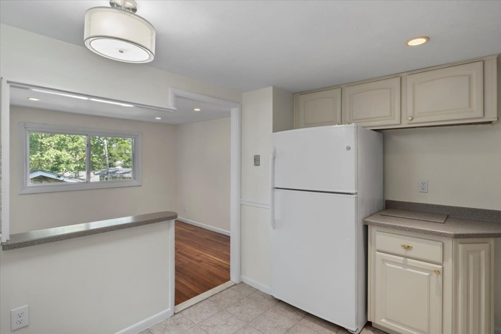 51 Joan Road Boston, MA 02136 - Photo 10 of 42 a white refrigerator freezer sitting in a kitchen