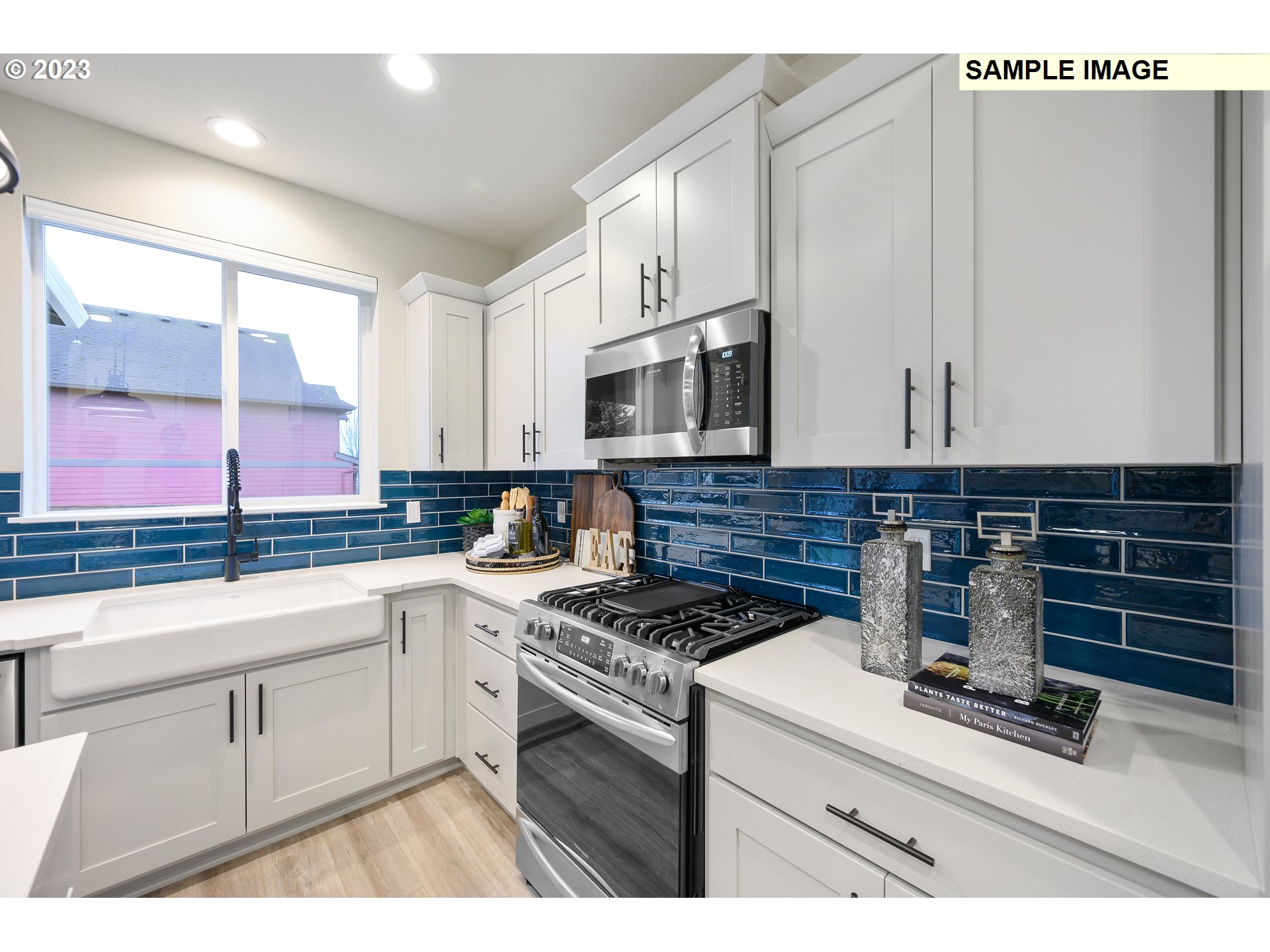 8843 North 3rd Circle, Unit 77 Ridgefield, WA 98642 - Photo 2 of 32 a kitchen with appliances a sink and cabinets
