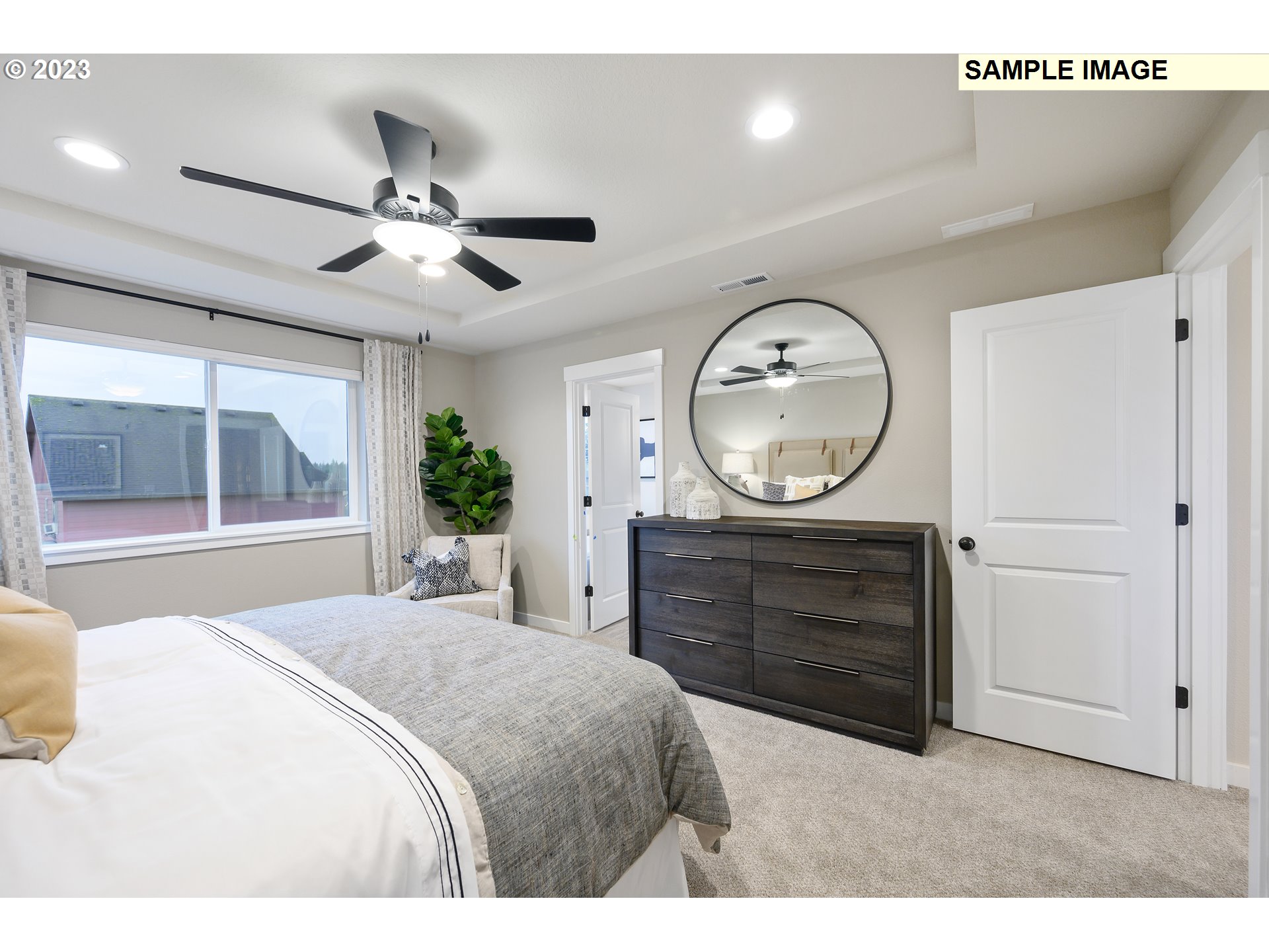 8843 North 3rd Circle, Unit 77 Ridgefield, WA 98642 - Photo 10 of 32 a bedroom with a bed and a dresser