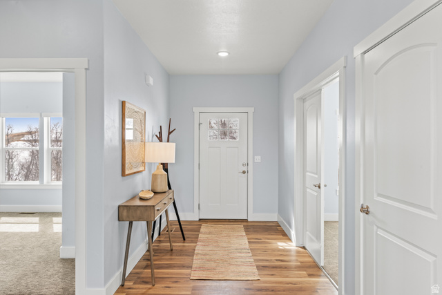 1343 North Trapper Loop Garden City, UT 84028 - Photo 4 of 56 Foyer featuring baseboards and light wood finished floors