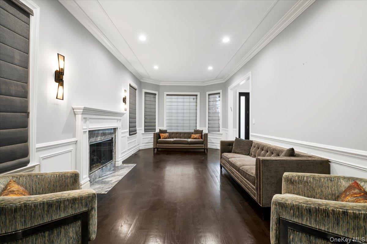 335 Summit Avenue Cedarhurst, NY 11516 - Photo 4 of 43 a living room with furniture and a fireplace
