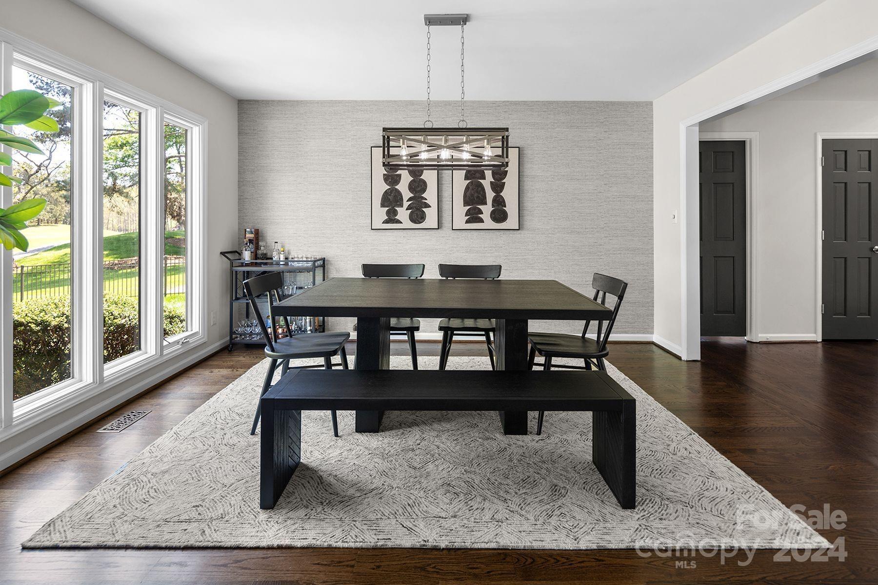 4201 Rounding Run Road Charlotte, NC 28277 - Photo 8 of 37 a view of a dining room with furniture window and wooden floor