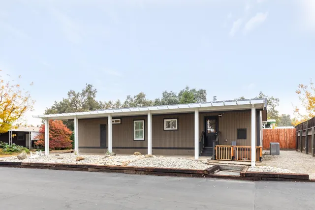 a view of a house with a sitting area