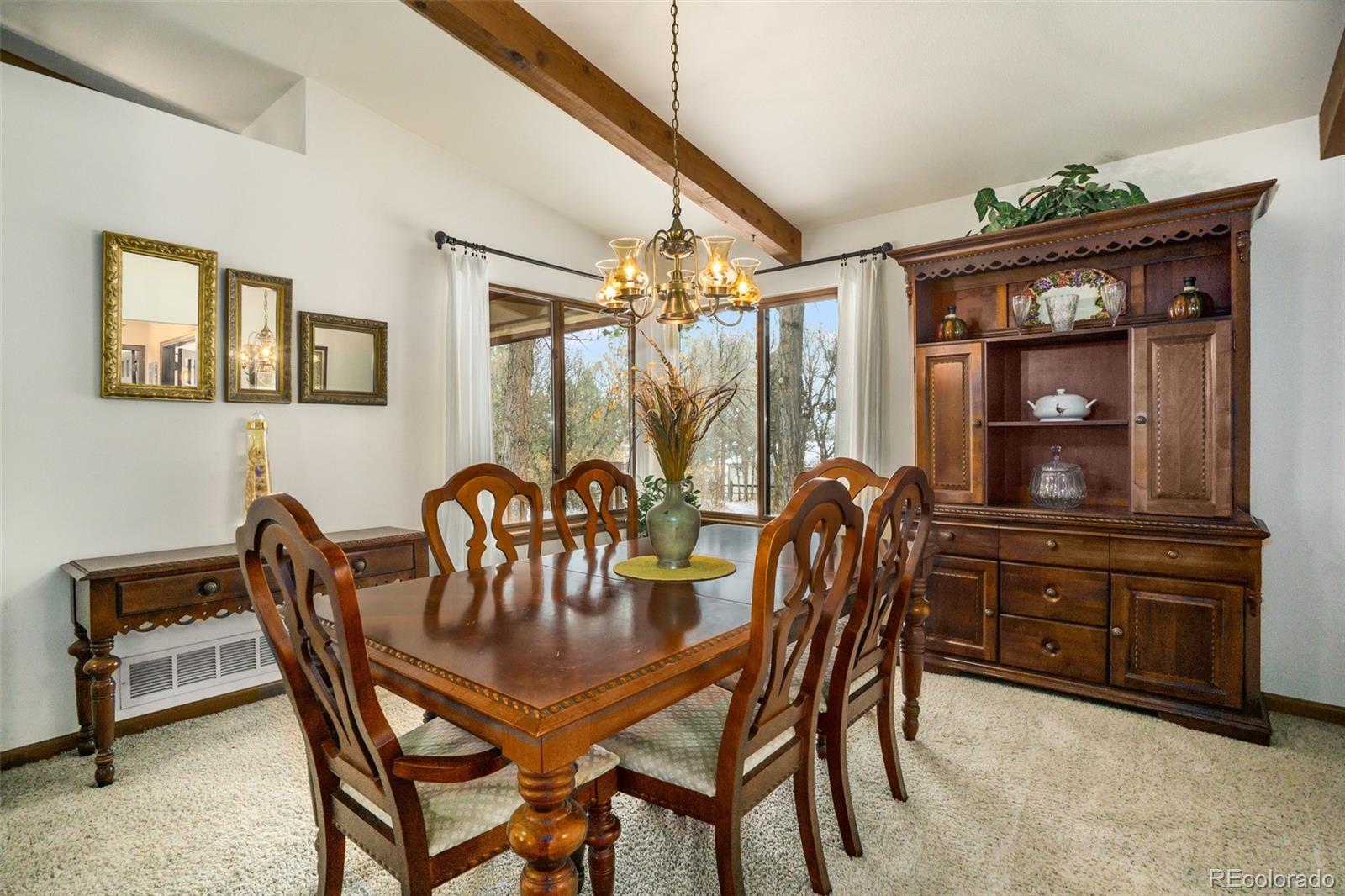 3640 Range View Road Monument, CO 80132 - Photo 10 of 35 a dining room with furniture and window