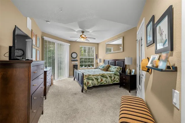 a bedroom with a bed and flat screen tv