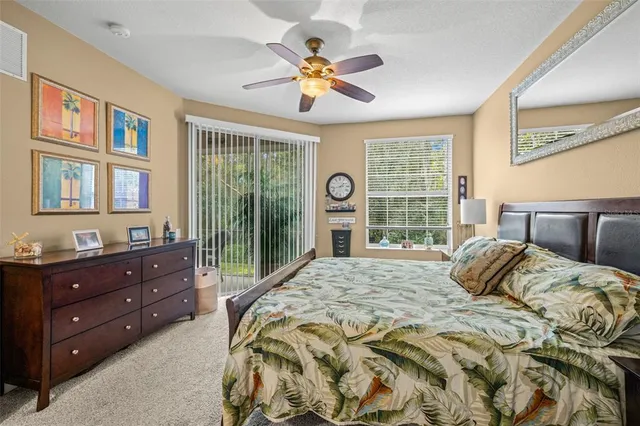 a bedroom with a bed dresser and a window