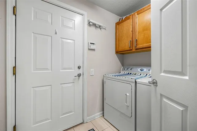 a view of storage and utility room with washer and dryer