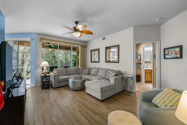 a living room with furniture and a large window