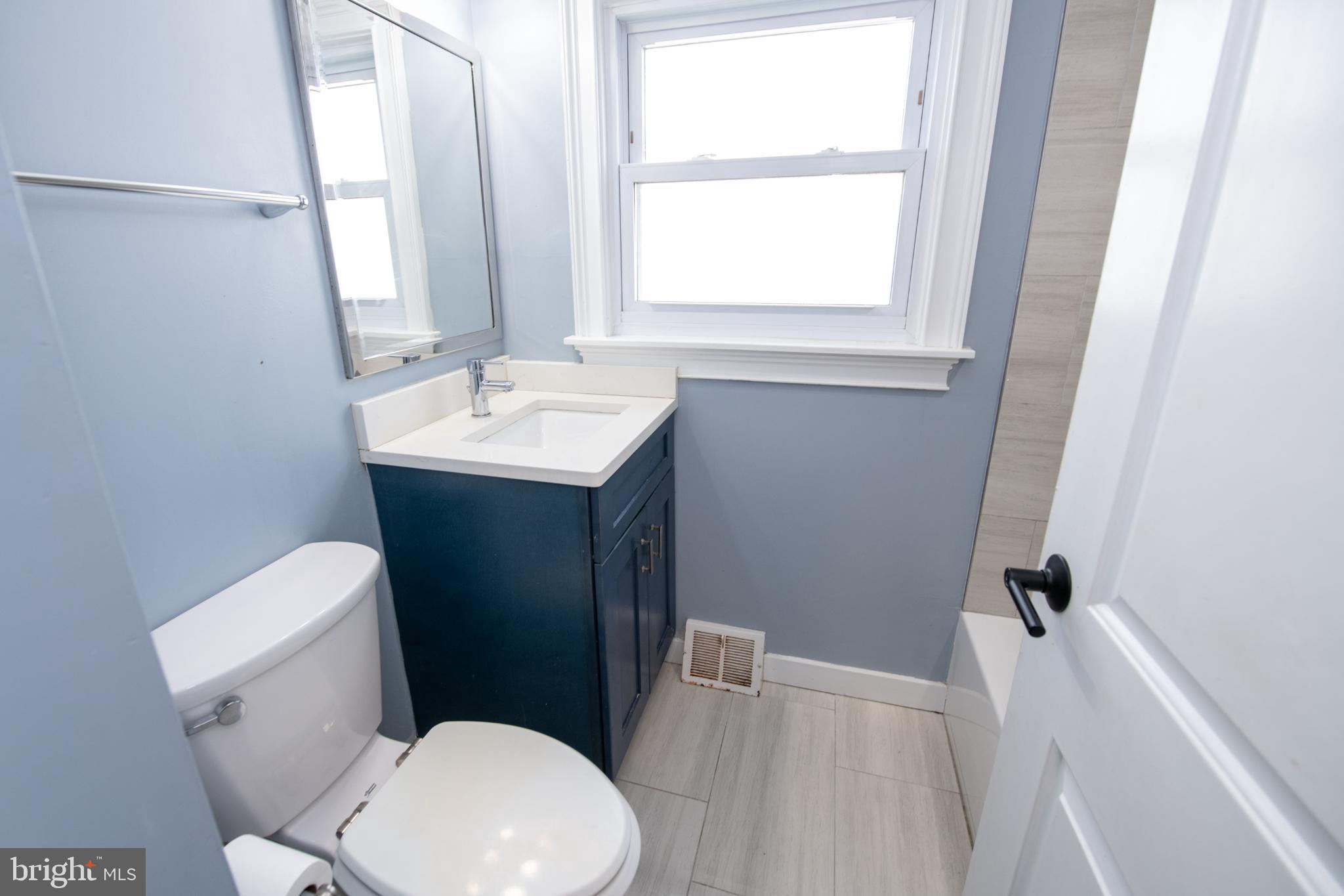 2849 Welsh Road Philadelphia, PA 19152 - Photo 14 of 36 Modern Hall bathroom with serene blue tones.