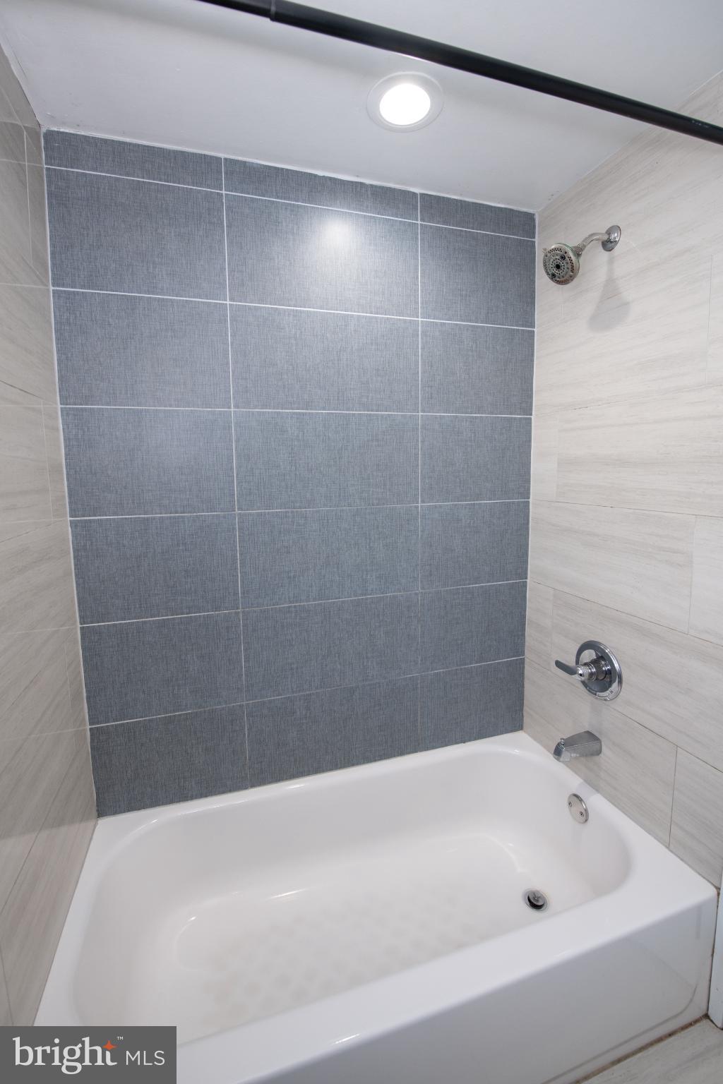 2849 Welsh Road Philadelphia, PA 19152 - Photo 16 of 36 Sleek modern bathroom with elegant tiles.