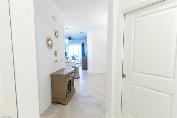a view of a kitchen from the hallway