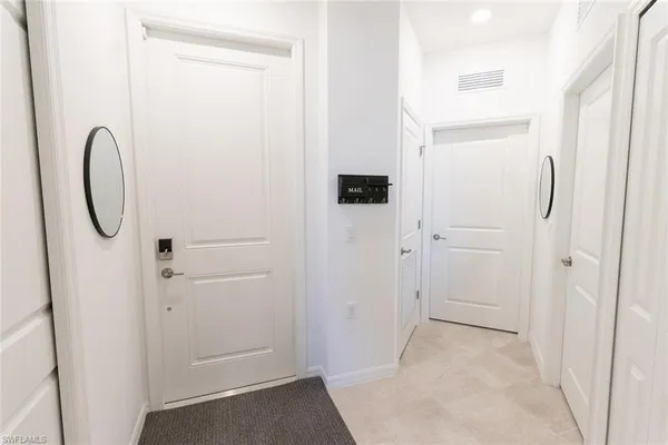 a view of a bathroom from a hallway