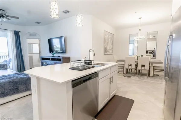 a room with sink a computer and view living room