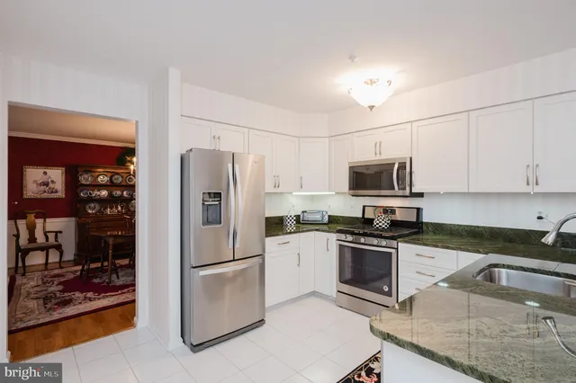 a bedroom with furniture and a flat screen tv