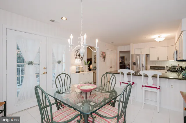 a living room with furniture wooden floor and a large window