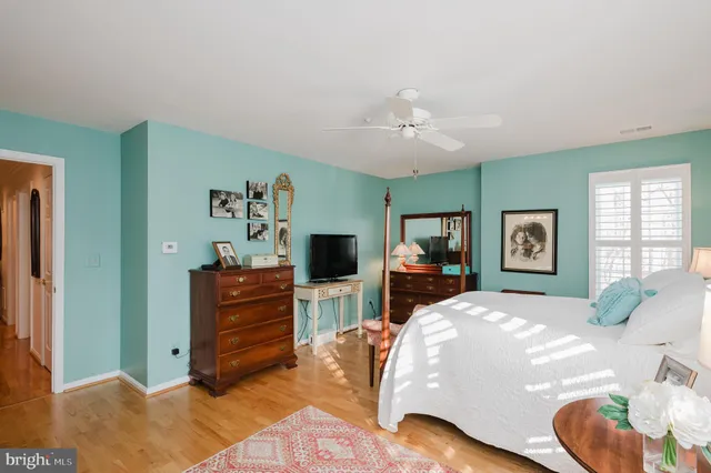 a bathroom with a sink mirror and on the wall