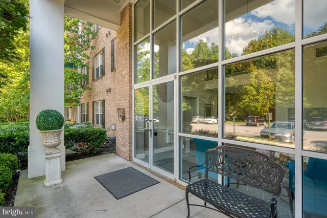 a view of a patio with table and chairs and potted plants