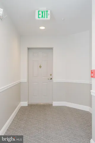 a living room with furniture fireplace and rug