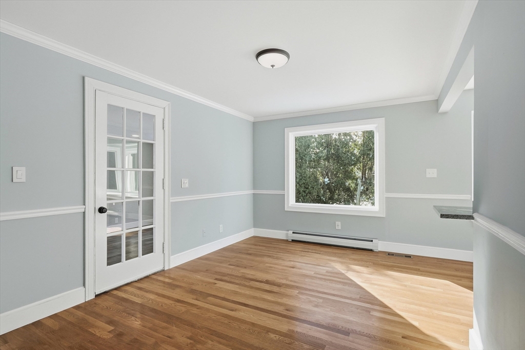 11 West Bradstreet Road North Andover, MA 01845 - Photo 12 of 42 a view of an empty room with wooden floor and a window