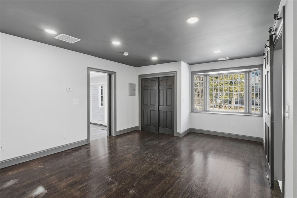 11 West Bradstreet Road North Andover, MA 01845 - Photo 18 of 42 an empty room with wooden floor and windows