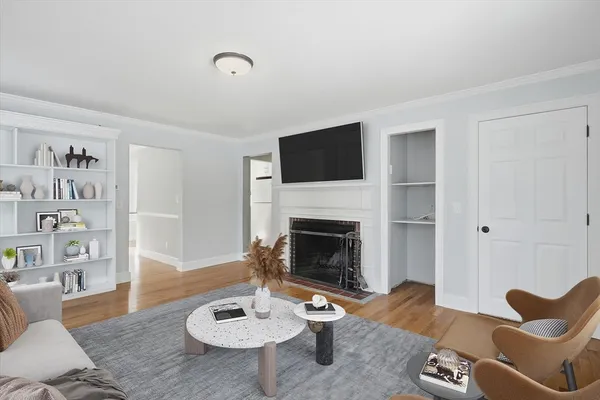 a living room with furniture and a fireplace