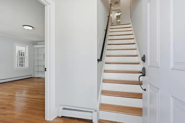 a view of an entryway with wooden floor
