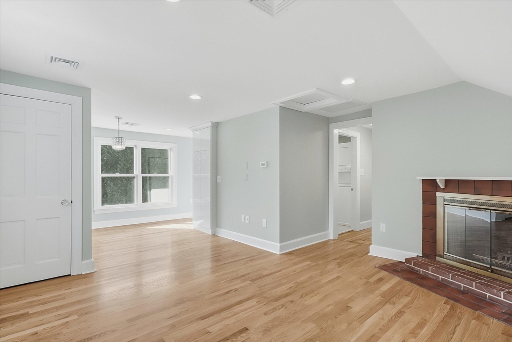 11 West Bradstreet Road North Andover, MA 01845 - Photo 24 of 42 a view of an empty room with wooden floor and a window