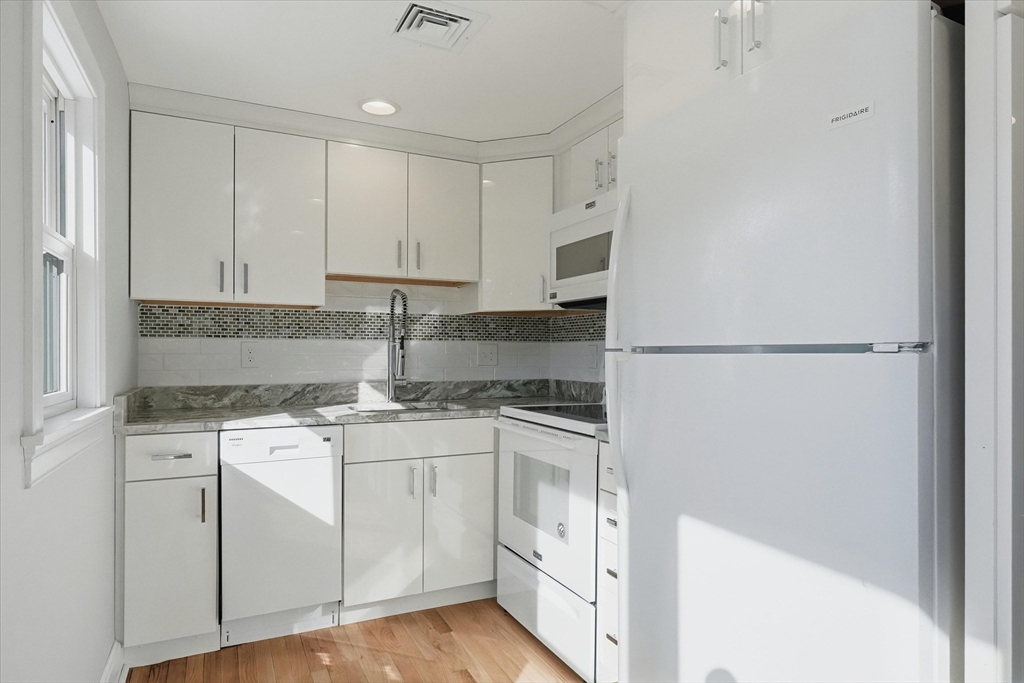 11 West Bradstreet Road North Andover, MA 01845 - Photo 26 of 42 a kitchen with stainless steel appliances granite countertop white cabinets and a counter top space