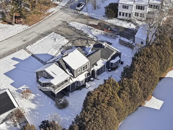 an aerial view of a house with a yard