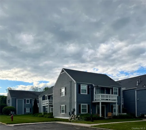 a front view of residential houses with yard