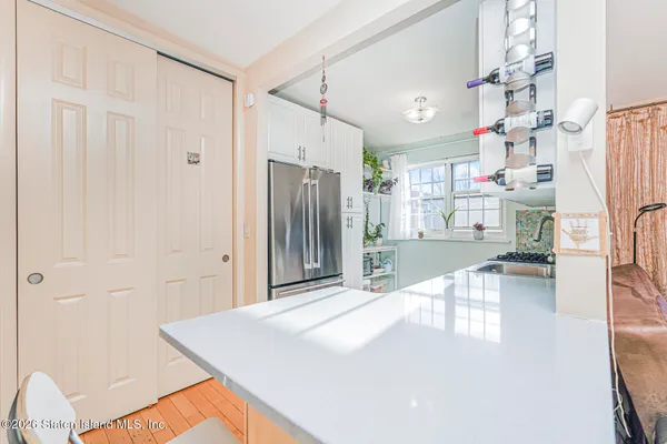 a kitchen with stainless steel appliances a refrigerator and a stove