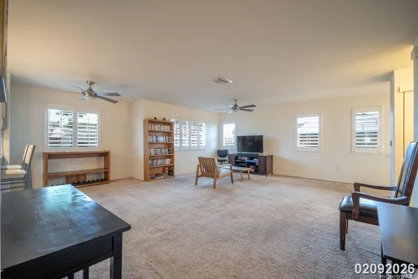 a view of a livingroom with furniture and a window