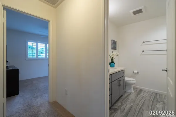 a bathroom with a toilet and a sink