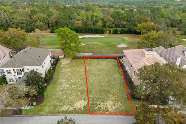 an aerial view of a residential houses with outdoor space