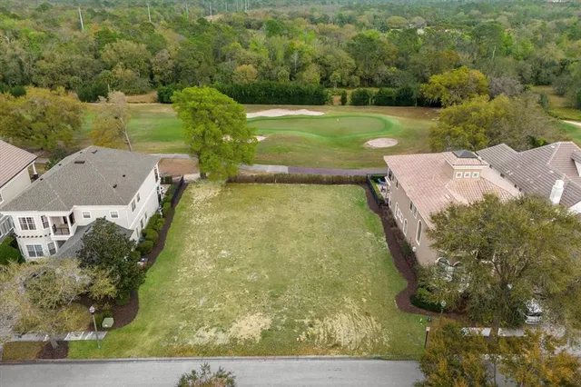 an aerial view of a houses with yard